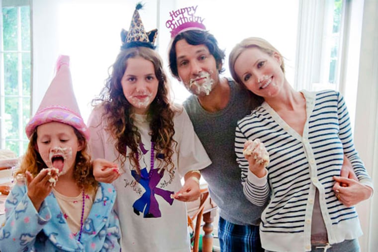 Paul Rudd, Leslie Mann, and Iris (left) and Maude Apatow. Mann is director Judd Apatow's wife, and the girls are theirs.