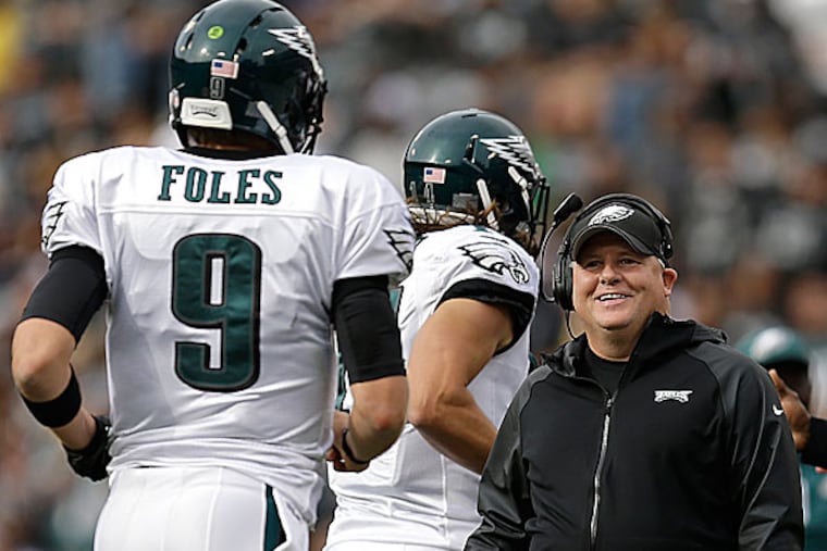 Eagles head coach Chip Kelly and quarterback Nick Foles. (Ben Margot/AP)