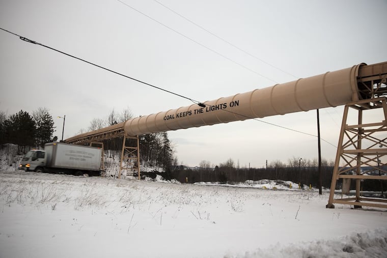 "Coal keeps the lights on" is written on a conveyor belt structure that crosses Route 54, the road that connects Mahanoy City and Shenandoah in the anthracite coal region of Pennsylvania.