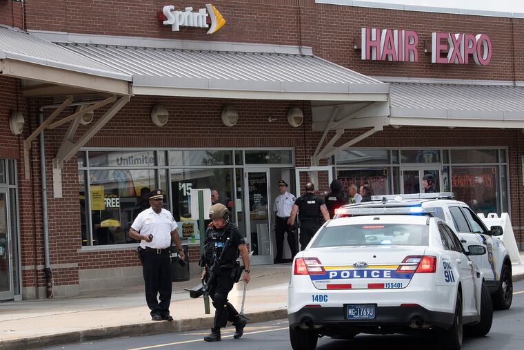 Philadelphia SWAT barricades the area at a Sprint store during a robbery on 7700 Crittenden St. Philadelphia, Pa. Sunday, July 7, 2019.