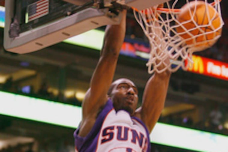 Phoenix's Amare Stoudemire dunks over the Lakers' Kwame Brown (right) and Lamar Odom. Brown was little help to the Lakers yesterday in their opening-round playoff loss to the Suns.