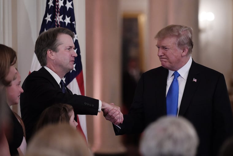 U.S. President Donald Trump shakes hands with Judge Brett Kavanaugh with after he nominated him to the Supreme Court during a ceremony in the East Room of the White House July 9, 2018 in Washington, D.C.