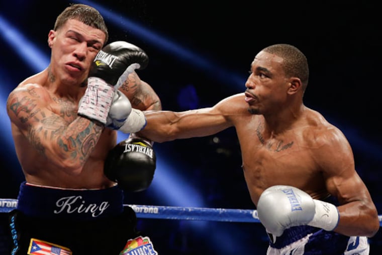 J'Leon Love, right, lands a punch against Gabriel Rosado in the fourth round during a NABF middleweight title fight, Saturday, May 4, 2013, in Las Vegas. (Isaac Brekken/AP)
