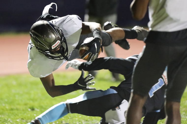 Timber Creek's Dior Boyd leaps into the end zone in the second quarter.