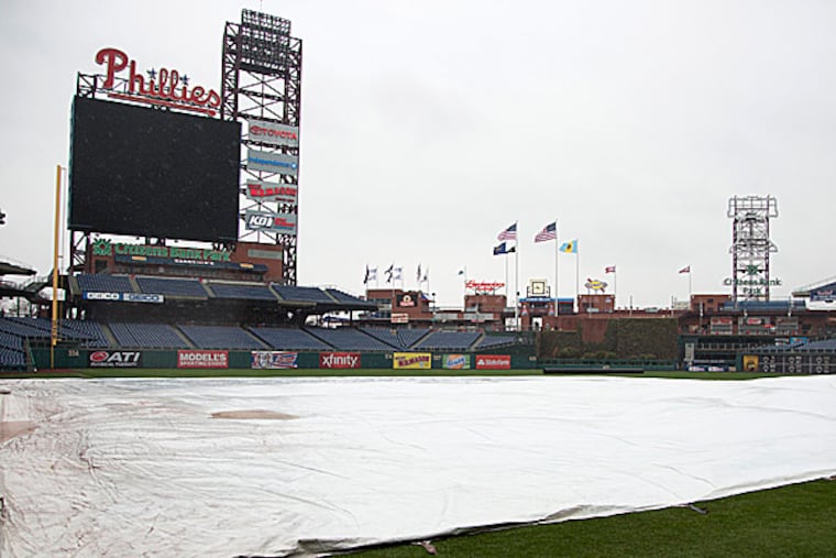 A tarp covers the field at Citizens Bank Park. (Chris Szagola/AP)