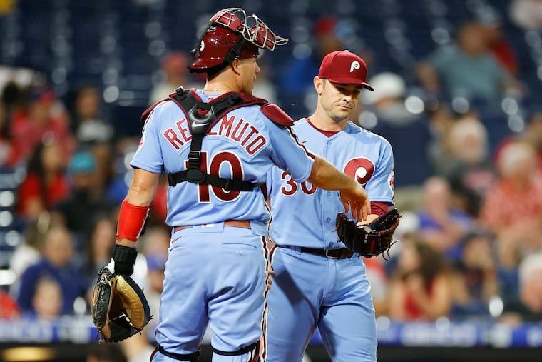 Phillies pitcher David Robertson receives the baseball from catcher J.T. Realmuto after Robertson gave-up a ninth inning RBI single to Miami Marlins Brian Anderson on Thursday, September 8, 2022 in Philadelphia.
