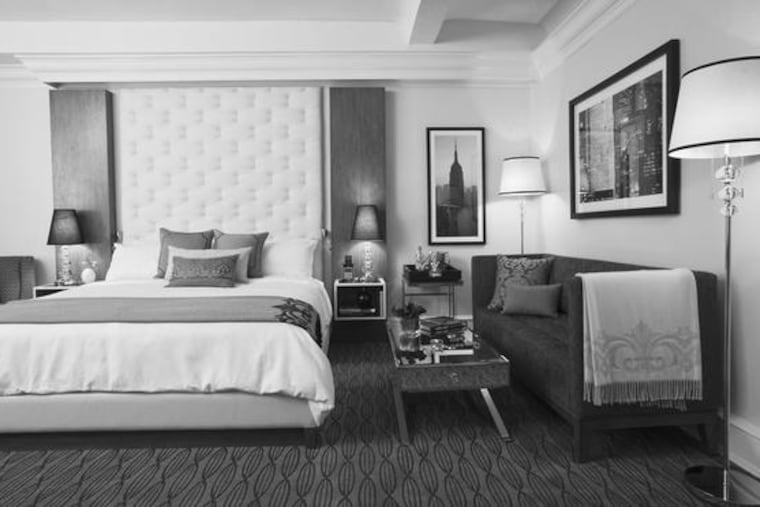 Guest rooms at The Carlton feature leather-tufted headboards.