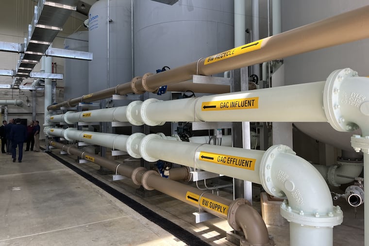 Officials inside Moorestown's newly expanded North Church Street Water Treatment Plant. The plant is now capable of filtering out the contaminant 1,2,3-trichloropropane and dioxin. The township will get a near $20 million zero-interest loan to pay for that expansion.