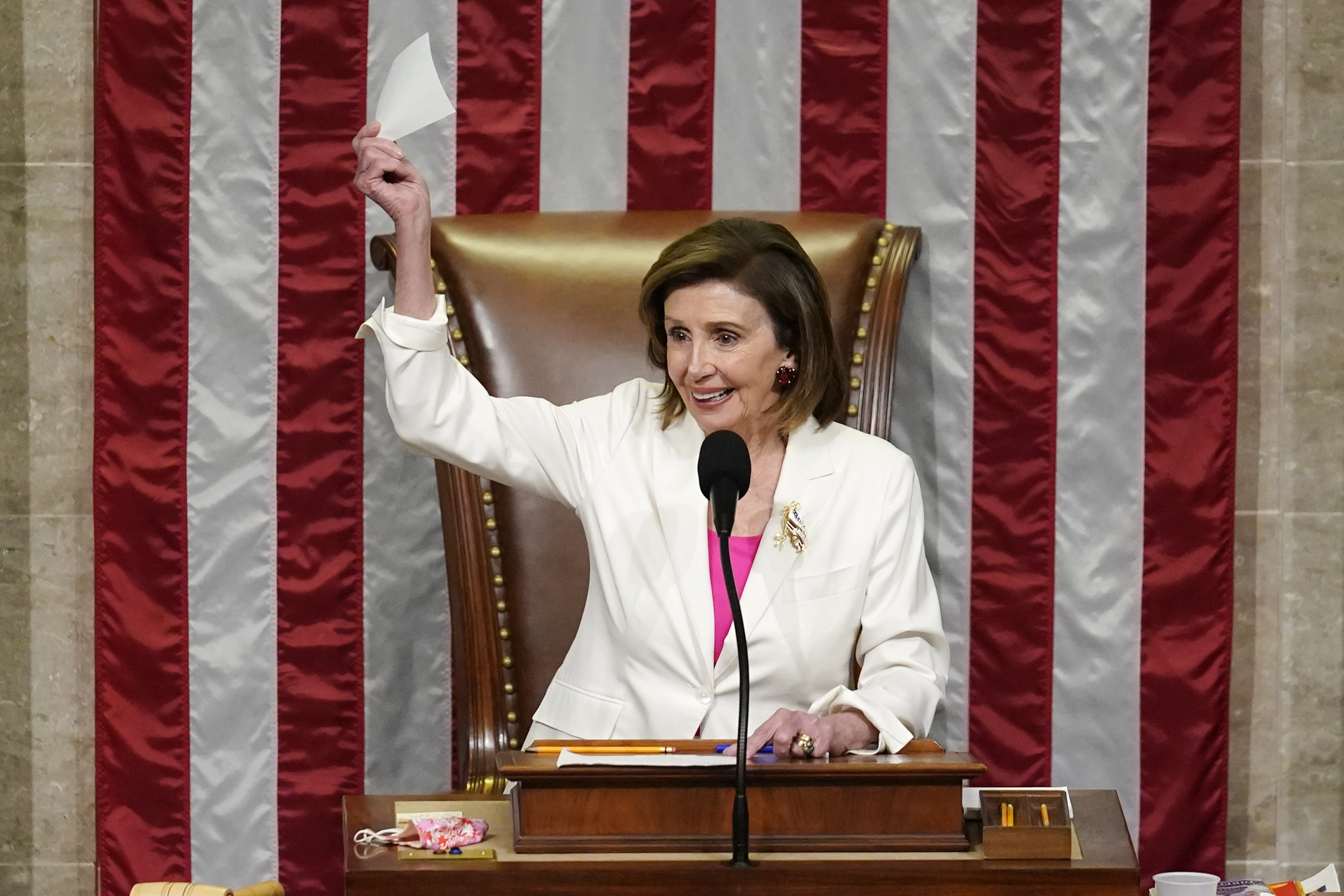 Speaker of the House Nancy Pelosi presides over House passage of President Biden's expansive social and environment bill at the Capitol in Washington on Friday.