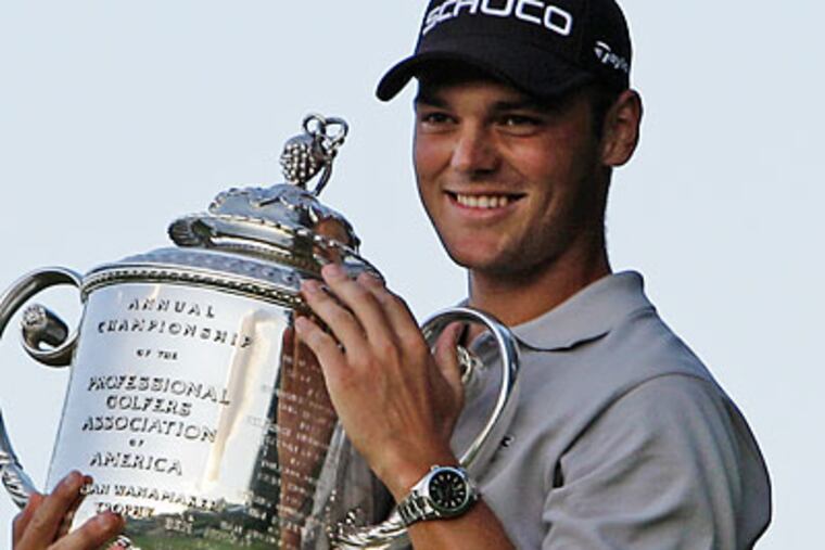 Martin Kaymer poses with the trophy after winning the PGA Championship in a playoff. (Charlie Neibergall/AP)
