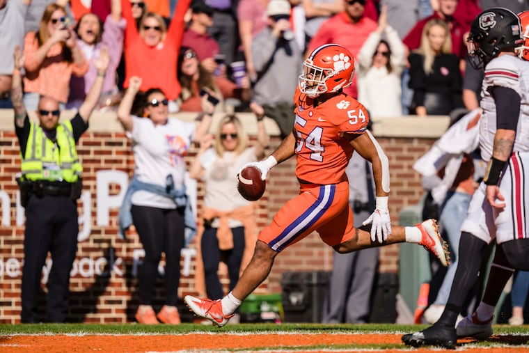 Clemson linebacker Jeremiah Trotter Jr. returns an interception for a touchdown against South Carolina on Nov. 26.