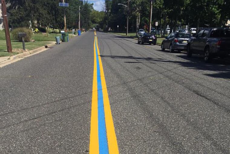 Blue lines have been painted on roads near a number of police stations in South Jersey to support officers. Police say the lines symbolize unity, but others say they distract from the national conversation about problems facing police departments.