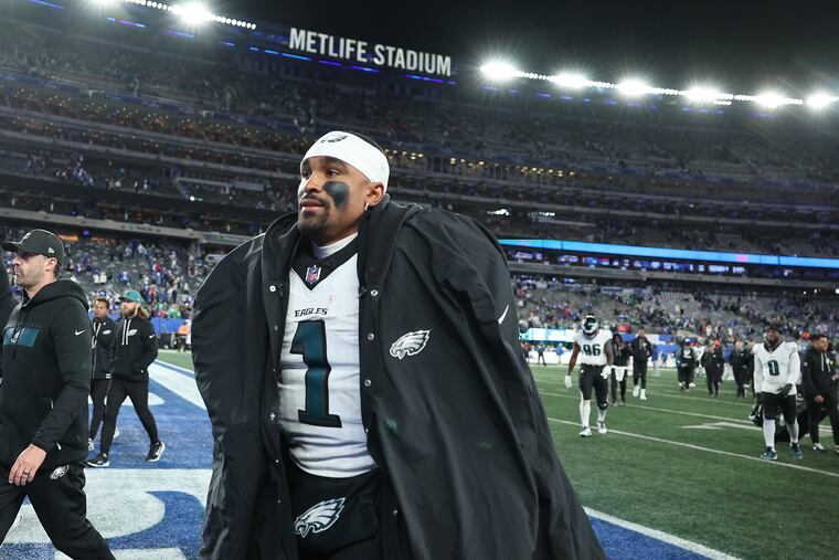 Eagles quarterback Jalen Hurts jogs off the field at MetLife Stadium following the team's loss to the Giants on Thursday night.