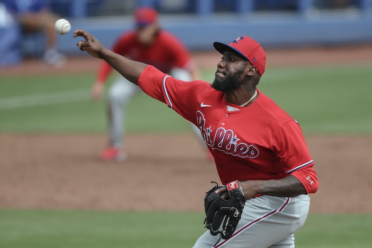 Phillies pitcher Enyel De Los Santos throws a 96-mph fastball to the Blue Jays' George Springer for a strikeout in the fifth inning at TD Ballpark in Dunedin, Fla.