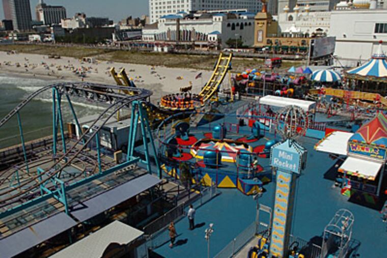 Atlantic City's Steel Pier, shown circa 2007, plans to build 121-foot-tall turbines for wind power if Gov. Christie signsa bill the Legislature passed last month.