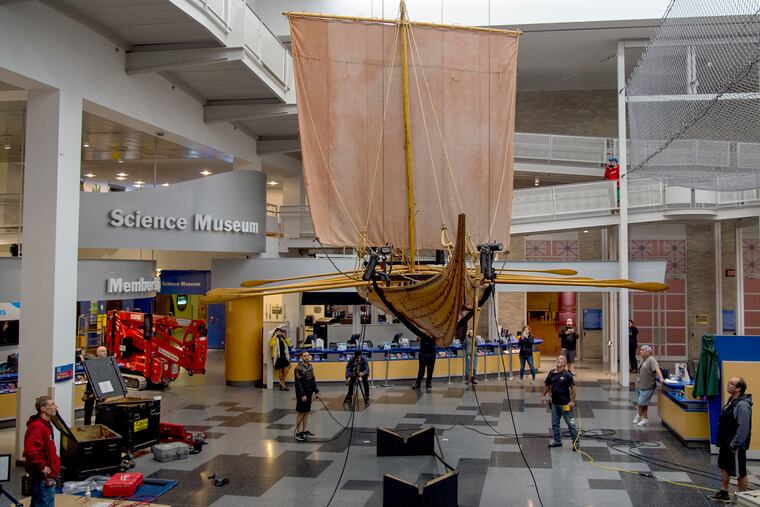 The 32-foot full scale replica Viking Ship ÒEik SandeÓ is hoisted and hung above the Franklin Institute's atrium lobby overnight September 27, 2018. ÒVikings: Beyond the Legend,Ó an extensive collection of 600 artifacts on loan from the National Museum of Denmark opens on October 13, 2018.