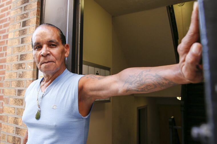 Josina Santos stands in front of her Northeast Philadelphia apartment complex.