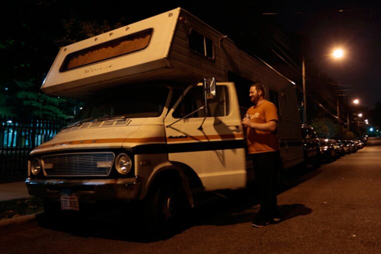 Rick Hall lives in an RV he has parked across the street from St. John's University in Queens, New York, where he attends classes. Hall, a veteran is allowed to park at a veteran's group and use its facilities. He is shown on Oct. 4, 2013. (Carolyn Cole/Los Angeles Times/MCT)