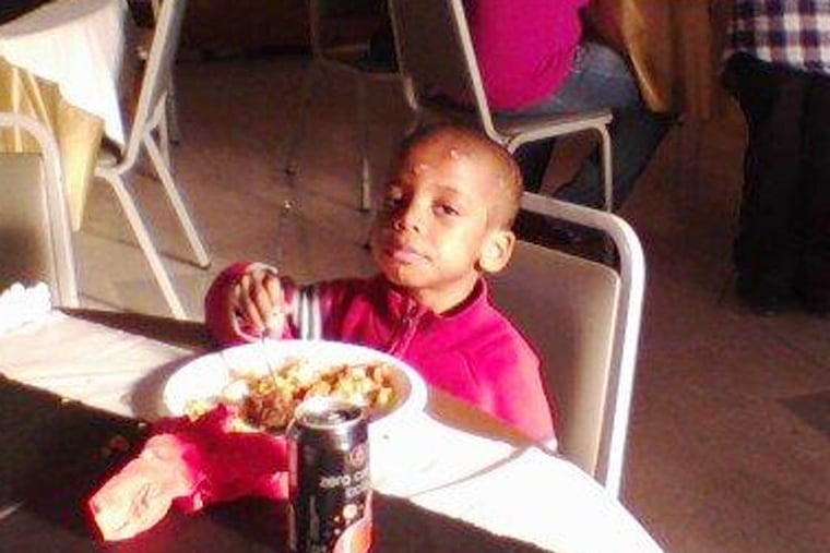 Khalil Wimes, with bruises visible on his face, in a family photograph.