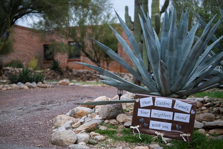 A sign of solidarity from neighbors is seen outside of Nancy Guthrie's home in Tucson, Ariz., on Thursday, Feb. 5.