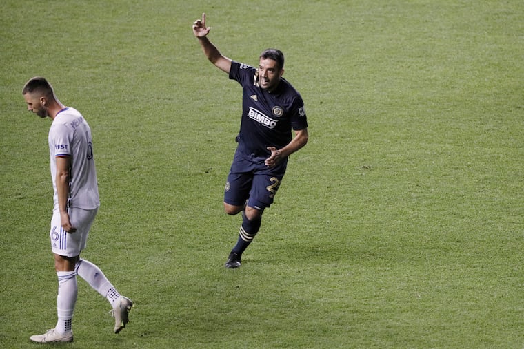 Ilsinho celebrates his goal for the Union as Cincinnati's Haris Medunjanin, a former teammate, walks away.