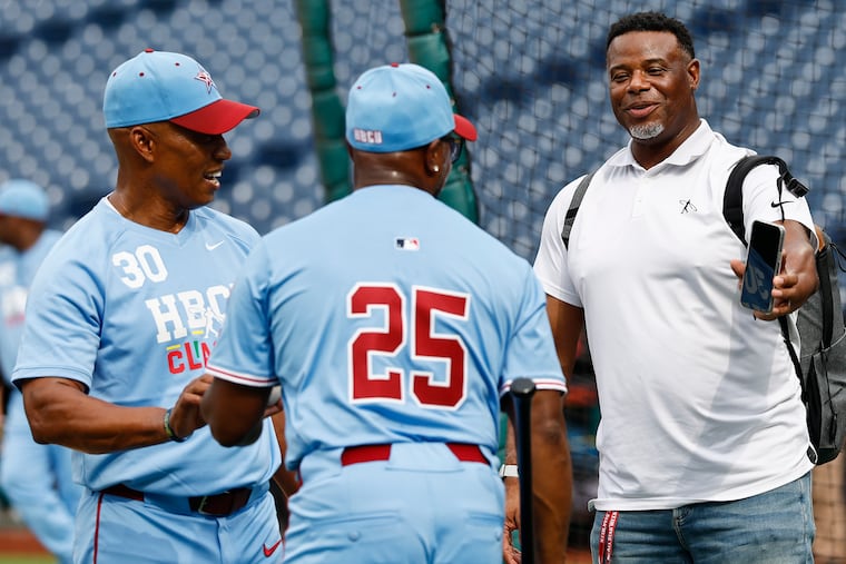 Ken Griffey Jr., (right) laughs with HBCU National League manager Jimmy Rollins (center) and coach Milt Thompson during batting practice before the HBCU Swingman Classic on Friday at Citizens Bank Park.