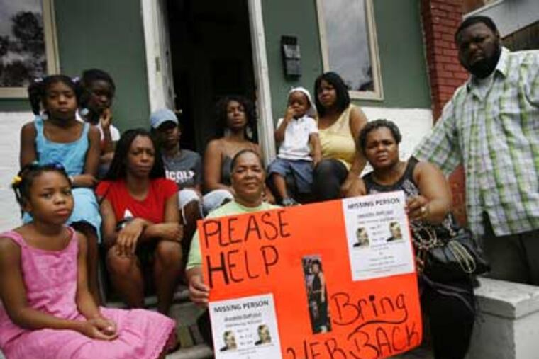 The family of Jeanette DuPriest in front of their home on Pentridge Street in Southwest Philadelphia. (Alejandro A. Alvarez / Staff)