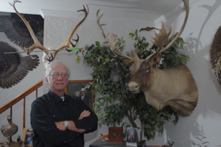 Joe Kleiner, age 69, of Hatfield has been hunting over 50 years. He stands next to a prized Caribou he took with a rifle. (Bob Williams/For The Inquirer)