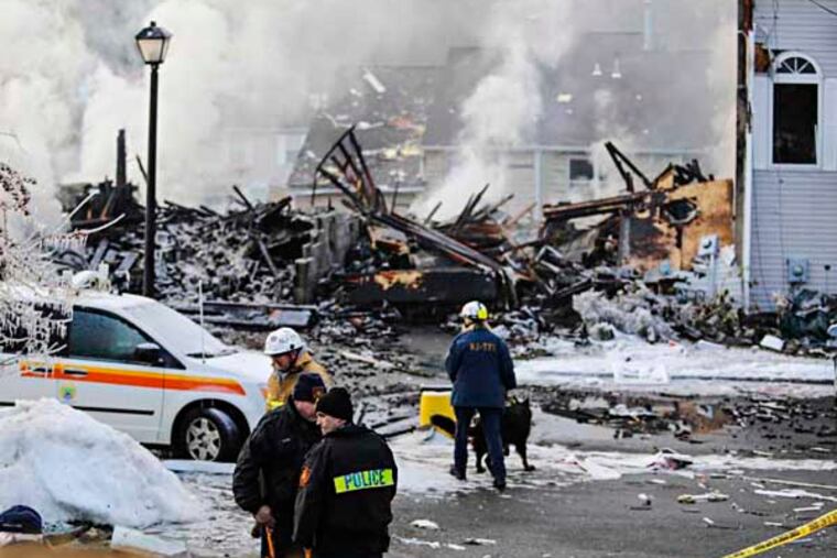 The scene of the house explosion in Ewing, NJ on Tuesday, March 4, 2014. (Stephanie Aaronson/Philly.com)