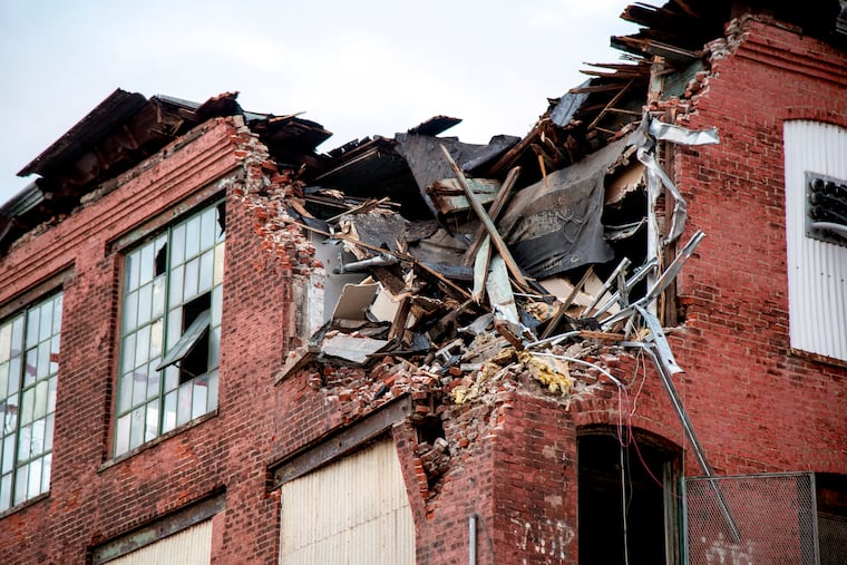 The site Apr. 1, 2021, where demolition was halted earlier at a 100-year-old hosiery mill building at 2400 E. Huntingdon. Acting after neighbors posted a video on Wednesday showing debris tumbling from the demolition site into the street, the cityÕs Licenses & Inspections agency told the workers to stop leveling building. Developer Gagandeep Lakhmna hired a contractor to raze the industrial building where he wants to build an apartment block.
