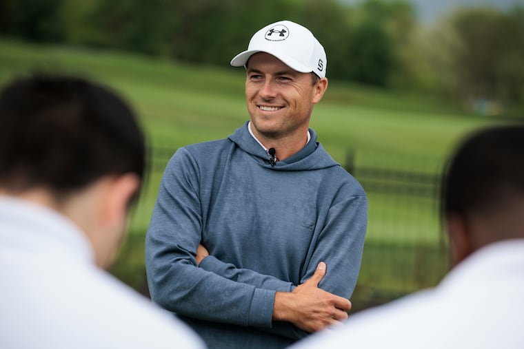 Jordan Spieth speaks with students on the putting green at the Cobbs Creek Golf Course TGR Learning Lab.