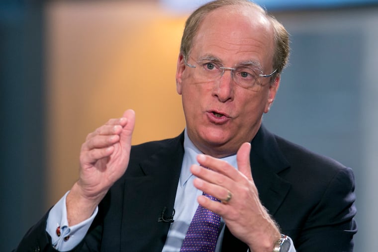 FILE - In this March 26, 2014 file photo, BlackRock Chairman and CEO Laurence Fink is interviewed by Maria Bartiromo on Fox Business Network's "Opening Bell with Maria Bartiromo," in New York. BlackRock, the world's largest asset manager, is making climate change central to its investment decisions going forward. Fink, who oversees the management of about $7 trillion in funds, said in his influential annual letter to CEOs Tuesday, Jan. 14, 2020, that he believes we are “on the edge of a fundamental reshaping of finance” because of a warming planet. (AP Photo/Mark Lennihan, File)