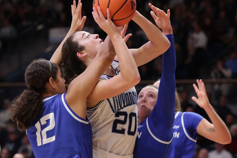 Maddy Siegrist (center) moved into second on Villanova's all-time scoring list, but the Wildcats came up short against Creighton in a battle of ranked foes.
