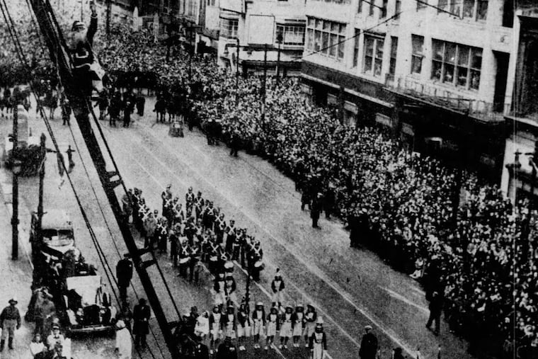 Santa Claus climbs the ladder to the “Toyland” section of Gimbel’s department store on Thanksgiving Day, 1944.