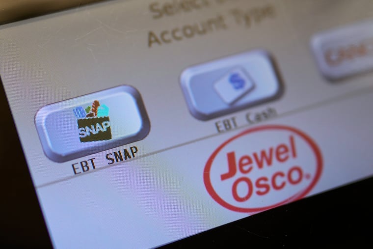 FILE - An EBT SNAP sign is shown on a self check out screen at a grocery store in Mount Prospect, Ill., Saturday, Nov. 1, 2025. (AP Photo/Nam Y. Huh, File)