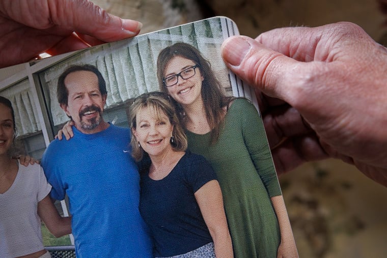 Paul and Martha Stringer, parents of Kim Stringer, pose in a family photo. The family is from Yardley, Pa. Their daughter Kim Stringer (right) had an acute psychotic episode, during which local police charged her with harassment and placed her in the Bucks County jail. The parents sued in 2022, and have become advocates for prison reform after their daughter's mistreatment.