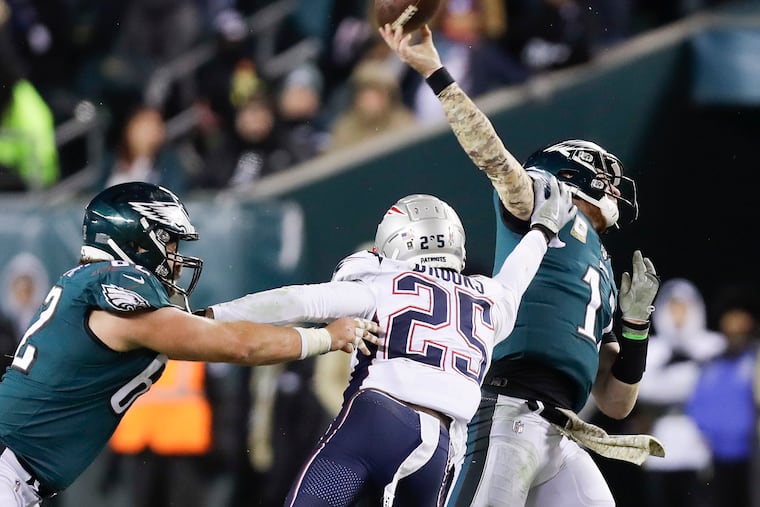 After Lane Johnson left the game with concussion symptoms, Carson Wentz was under duress for the rest of the night.