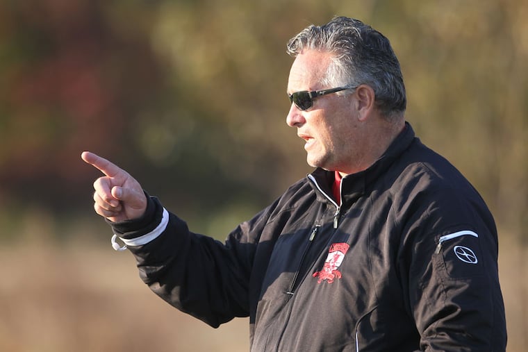 Kingsway coach John Kodluk talks to his team at halftime. (Charles Fox/Staff Photographer)