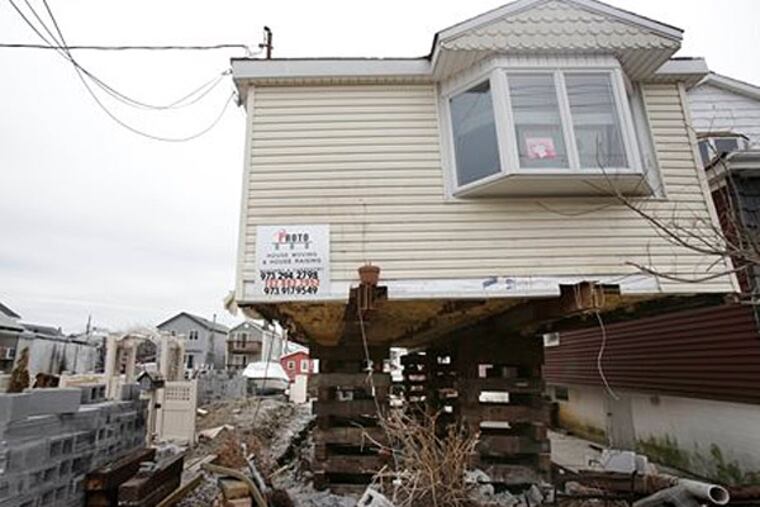 New Jersey on Monday announced a $100 million fund to help primary homeowners with the cost of elevating homes damaged by Hurricane Sandy. (AP Photo/Seth Wenig)