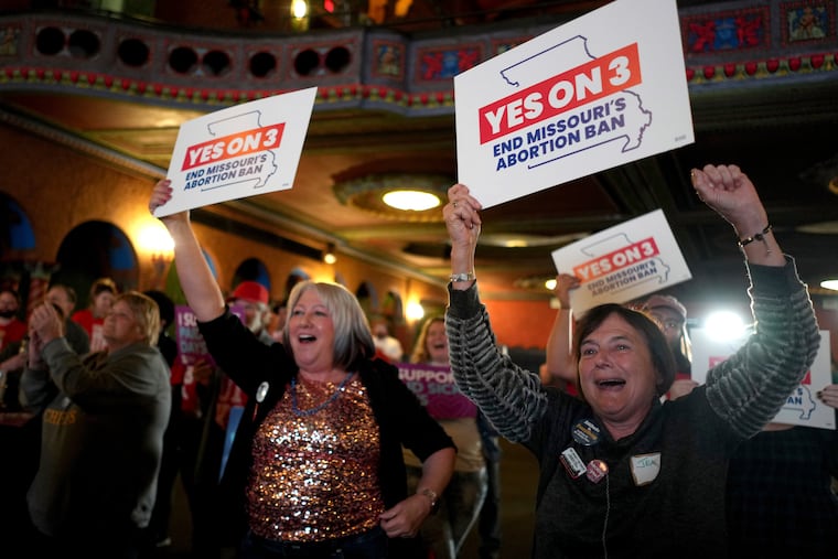 People at an election night watch party react after an abortion rights amendment to the Missouri constitution passed in Kansas City, Mo.