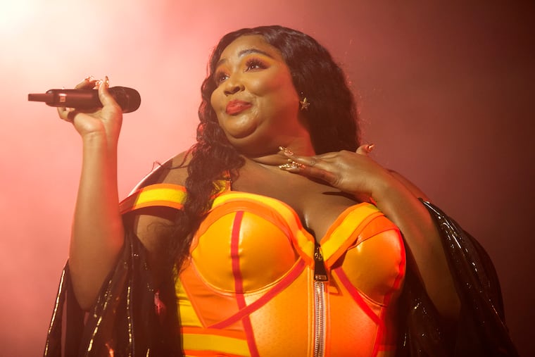 FILE - This Sept. 18, 2019 file photo shows Lizzo performing at The Met in Philadelphia. Lizzo earned eight Grammy Award nominations, Wednesday, Nov. 20, making her the show’s top-nominated act. The 62nd Grammy Awards will air live from the Staples Center in Los Angeles on January 26. (Photo by Owen Sweeney/Invision/AP, File)