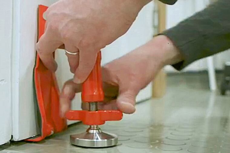 Travel Gear: DoorJammer Portable Security Brace. The DoorJammer is a simple but ingenious configuration of hinges and angles that anchor it to the floor and against the door, exerting substantial bracing force against pressure from the outside.