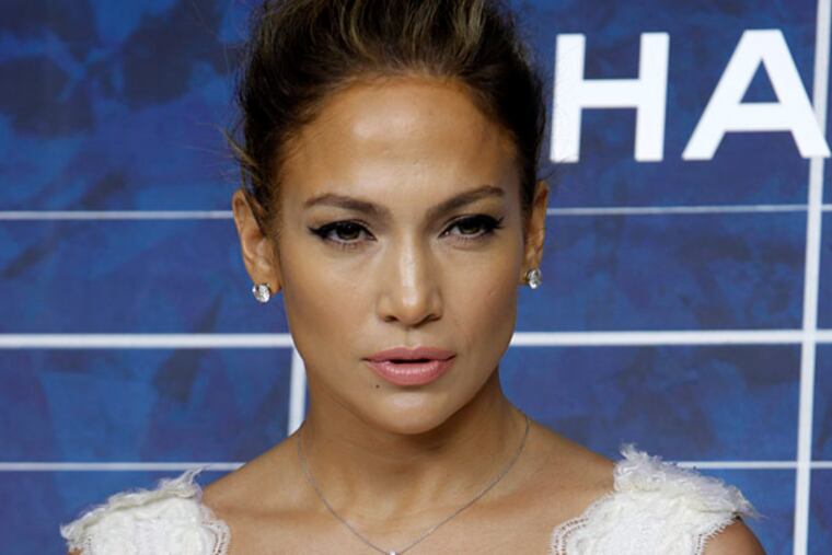 FILE - In this Oct. 2, 2012 file photo, Jennifer Lopez arrives for the presentation of Chanel's ready-to-wear Spring-Summer 2013 collection in Paris. (AP Photo/Thibault Camus, File)