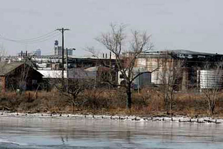 A view of some of the former oil processing and storage facilities at Petty Island in January 2009. ( Akira Suwa / Staff Photographer )
