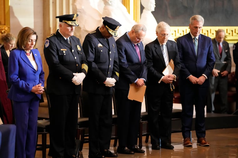 From left, Speaker of the House Nancy Pelosi of Calif., U.S. Capitol Police Chief J. Thomas Manger, Washington D.C. Metropolitan Police Chief Robert J. Contee, Senate Minority Leader Mitch McConnell of Ky., and House Minority Leader Kevin McCarthy of Calif., pray during a Congressional Gold Medal ceremony honoring law enforcement officers who defended the U.S. Capitol on Jan. 6, 2021, in the U.S. Capitol Rotunda.
