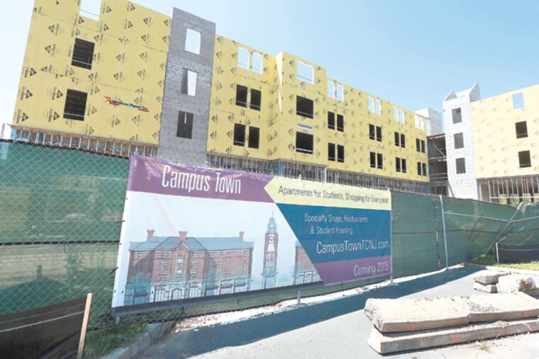 The College of New Jersey has partnered with private developers to build a "Campus Town" on 12 acres adjacent to campus to house about 450 students and offer retail amenities Wednesday, August 27, 2014. (DAVID SWANSON/Staff Photographer)
