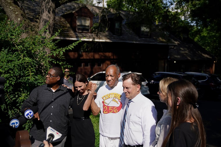 Bill Cosby (center), accompanied by spokesman Andrew Wyatt (left), attorney Jennifer Bonjean (second from left), and attorneys Brian Perry and Ashley Cohen, makes his first public appearance at his home in Elkins Park, Pa., after being released from prison.