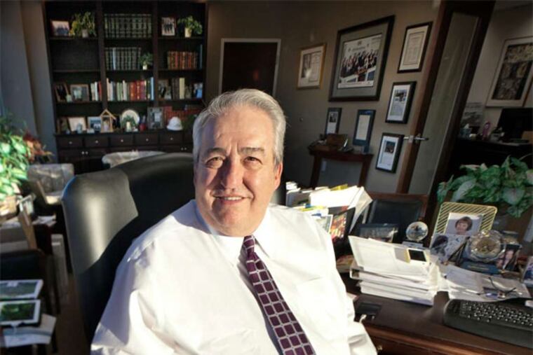 Irvin E. Richter, in his Marlton office, says that the key to getting contracts abroad is to discuss the project, not politics. However, internal politics slowed payment from Libya on a $60 million bill. (David M Warren / Staff Photographer)