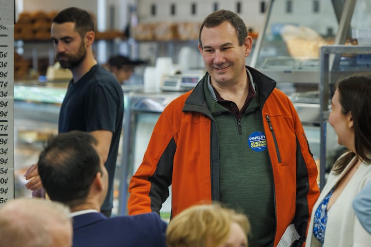 Mark Pinsley, during his unsuccessful primary campaign for auditor general in 2024, chats with Pennsylvania State Rep. Tarik Khan (seated) at the Election Day lunch in Philadelphia.