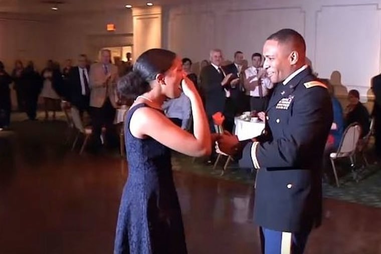 Archbishop John Carroll High School freshman Jasmine Vega gets a surprise visit from her dad, who is in the U.S. Army.